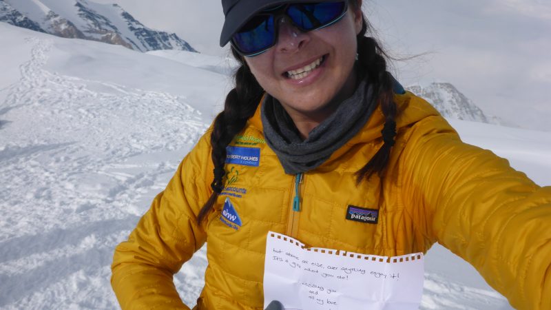 Alex reading a friend's letter on the summit of Denali, N. America